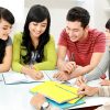 Group of asian students studying together at home